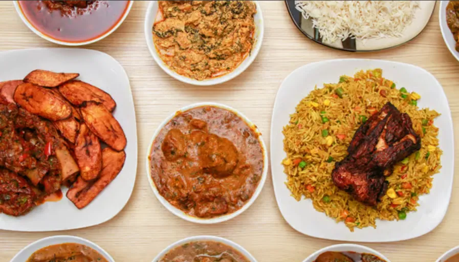 Loo Afro Naija Cuisine signature Nigerian dishes - Jollof Rice and Egusi Soup in Edmonton