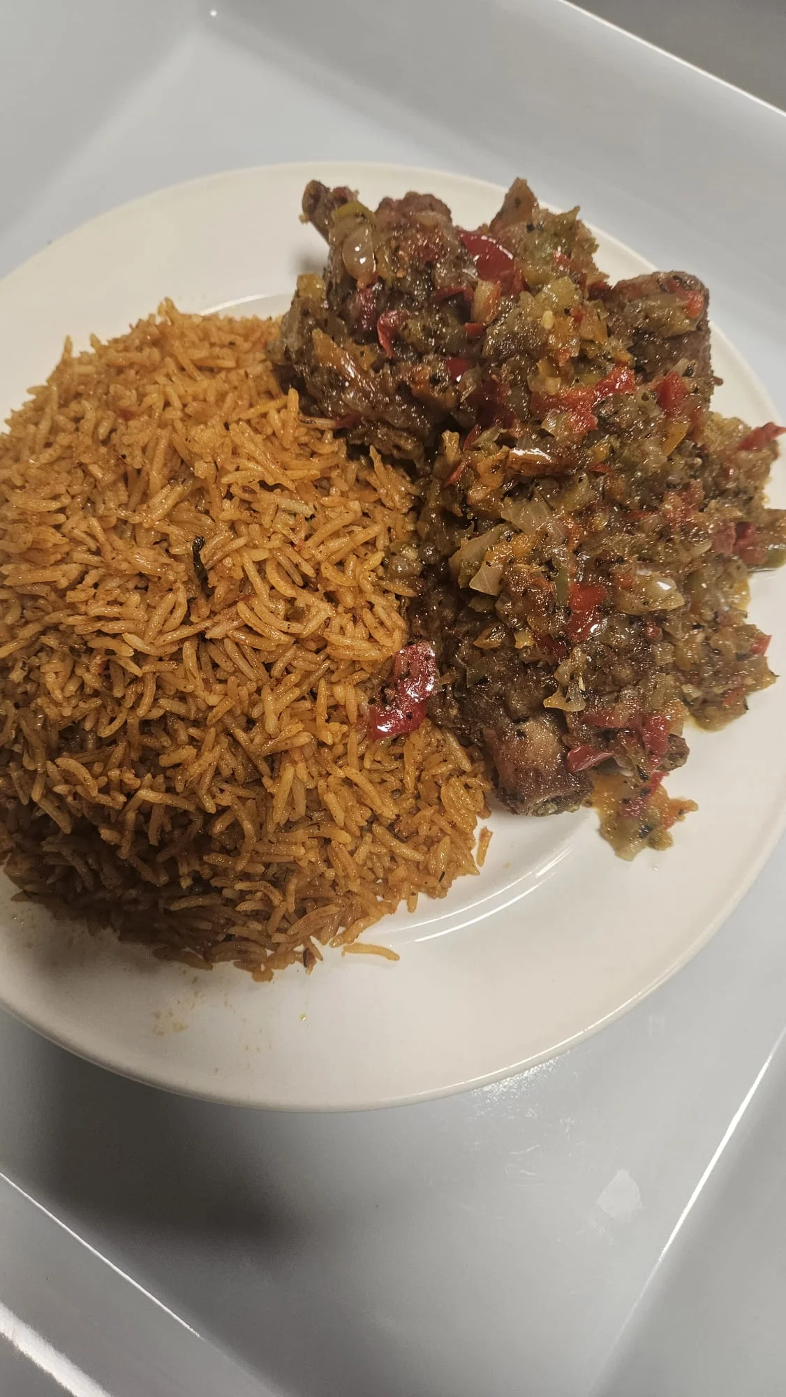 Delicious Spicy Goat Rice at Loo Afro Naija Cuisine Nigerian Restaurant in Edmonton, AB